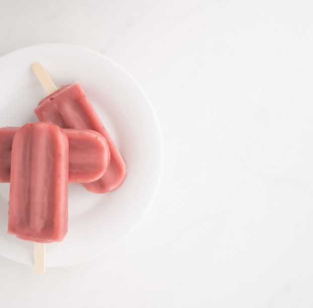 colorful popsicles on a plate for fun family activities